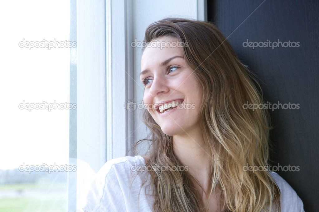 Woman smiling and looking outside