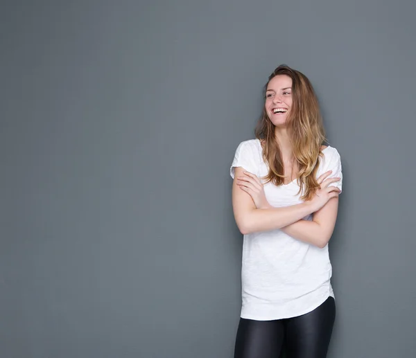 Woman laughing with arms crossed — Stock Photo, Image