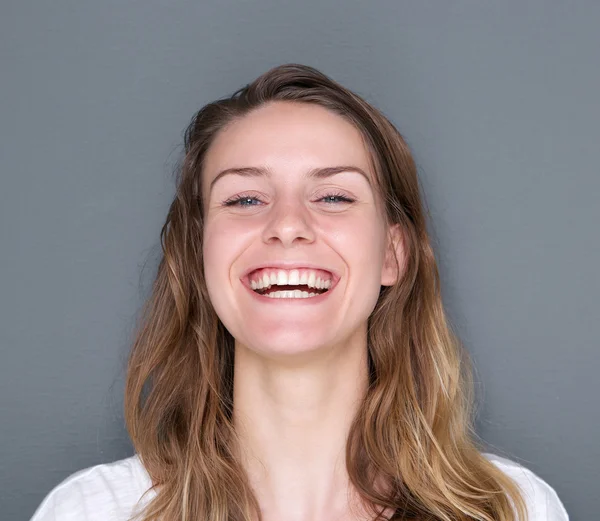 Cheerful young woman laughing — Stock Photo, Image