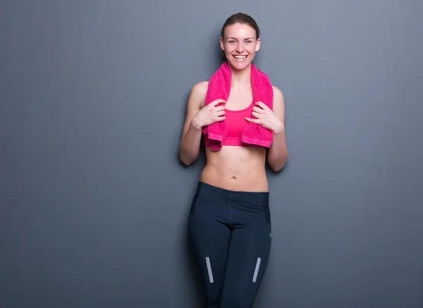 Cute young woman smiling after exercise — Stock Photo, Image