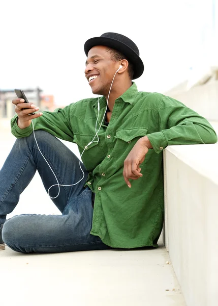 Young man listening to call on mobile phone — Stock Photo, Image