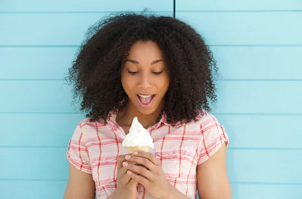 Woman looking surprised with ice cream — Stock Photo, Image