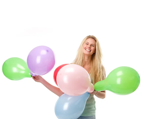 Χαμογελώντας νέα γυναίκα που κρατά μπαλόνια — Φωτογραφία Αρχείου