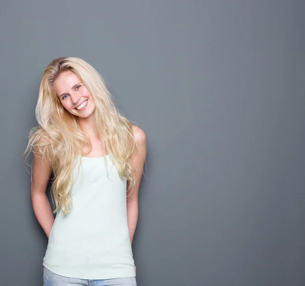 Attractive young blond woman smiling — Stock Photo, Image