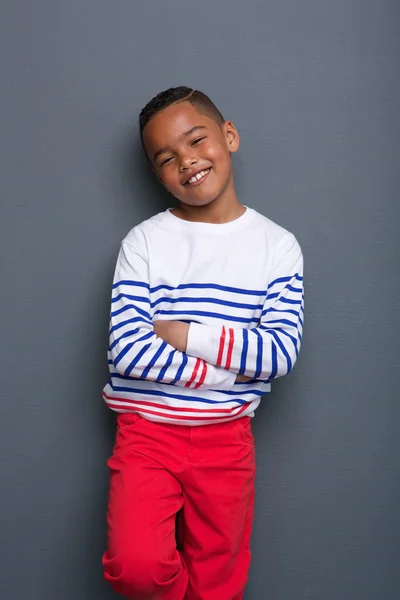 Smiling little boy with arms crossed — Stock Photo, Image