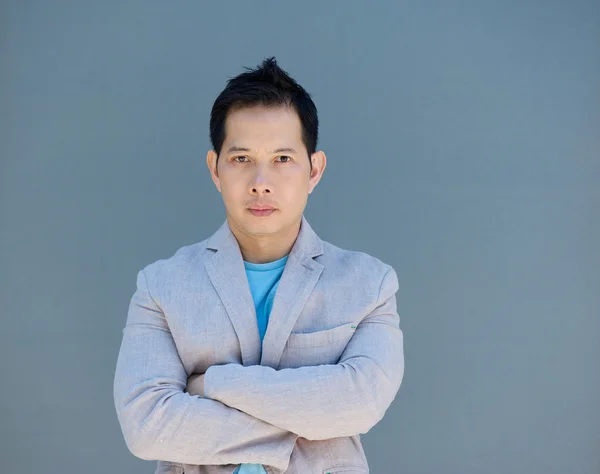 Asian man posing with arms crossed — Stock Photo, Image