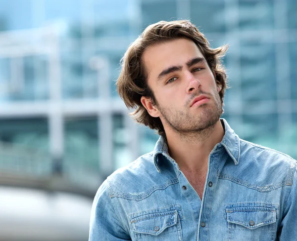 Attractive young man standing outside — Stock Photo, Image