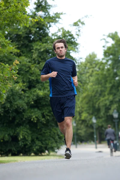 Full body of a young man jogging — Stock Photo, Image