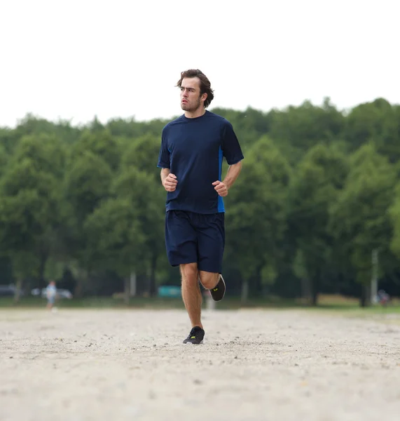 Healthy young man jogging — Stock Photo, Image