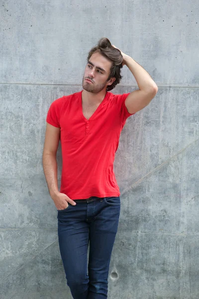 Cool guy posing with hand in hair — Stock Photo, Image