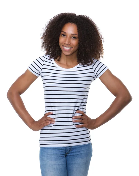 Woman with curly hair smiling with hands on hip — Stock Photo, Image