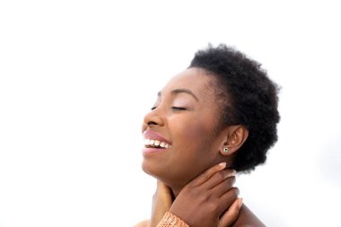 Close up profile portrait beautiful smiling young african American woman against isolated white background eyes closed