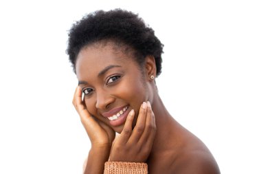 Close up portrait young african American woman smiling with hands on face by isolated white background 