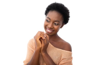 Portrait smiling young beautiful black womqn glancing by isolated white background