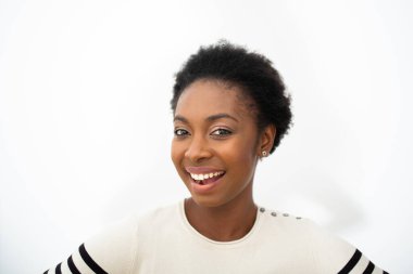 Close up portrait beautiful young African American woman smiling by white isolated background 