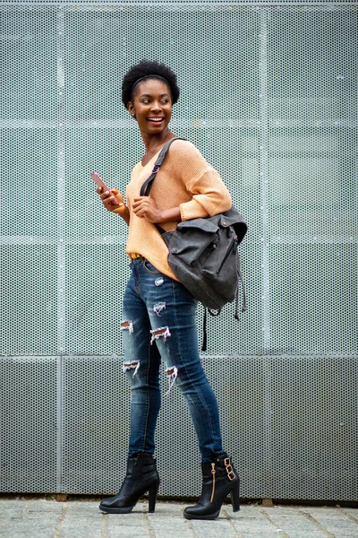 Full Body Side Portrait Smiling Young Black Woman Holding Cellphone — Stockfoto