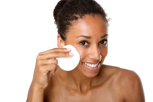 Young woman removing make up with pad — Stock Photo, Image