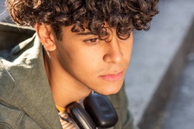 Close up portrait thinking young North African guy