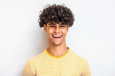 Close up face portrait young North African guy laughing against white background