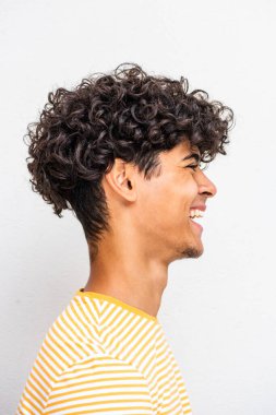 Close up profile portrait cheerful young North African man 