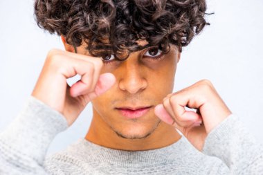 Close up portrait young fighting man with fists up