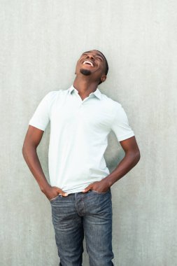 Portrait cheerful young African American laughing and looking up