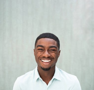 Close up portrait laughing young black man 