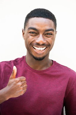 Close up portrait cool young black man with thumbs up hand sign