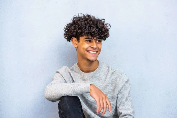 Portrait Young Guy Sitting Blue Wall Smiling — Stock fotografie