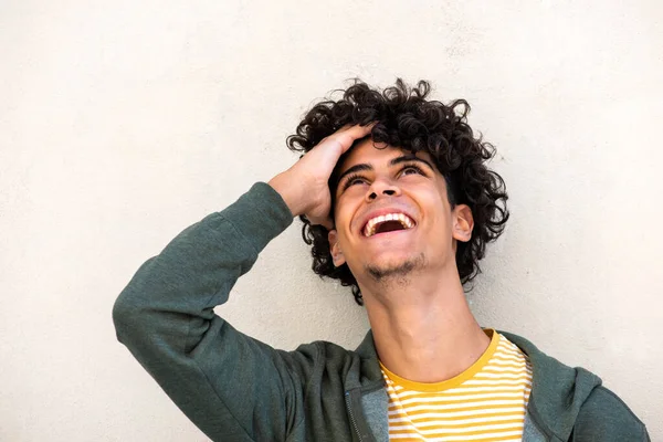 Close Portrait Young Man Laughing Hand Hair Looking White Background – stockfoto