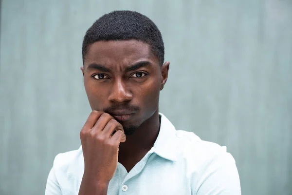 Close Portrait Serious Young African American Man Staring Hand Chin — стоковое фото