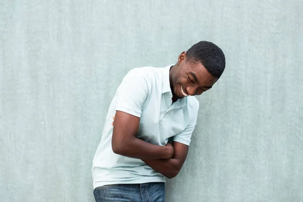 Portrait Laughing Young African American Man Arms Crossed Standing Wall — Foto Stock