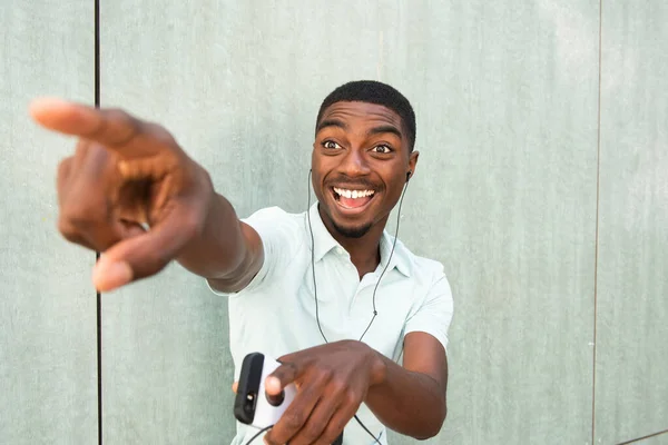 Close Portrait Laughing Young African American Man Listening Music Earbuds — стоковое фото