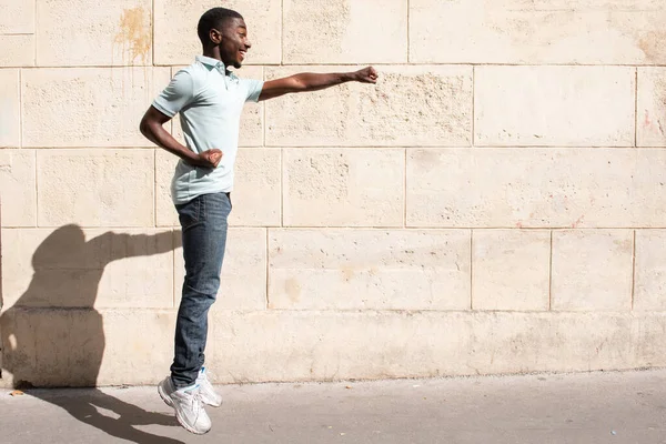 Side Portrait African American Man Jumping Arms Outstretched Punching — Photo