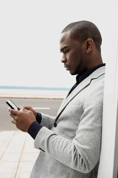 Profile Portrait African American Businessman Leaning Wall Looking Cellphone — Stock Photo, Image