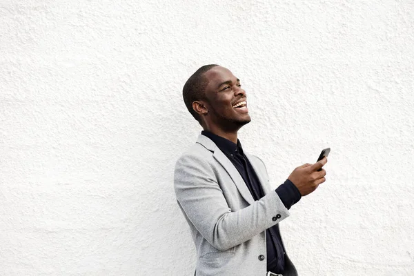 Portrait Happy African American Businessman Laughing Phone Hand White Wall — Stock Photo, Image