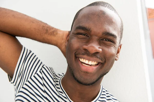 Close Portrait African American Man Smiling Hand Head White Wall — ストック写真