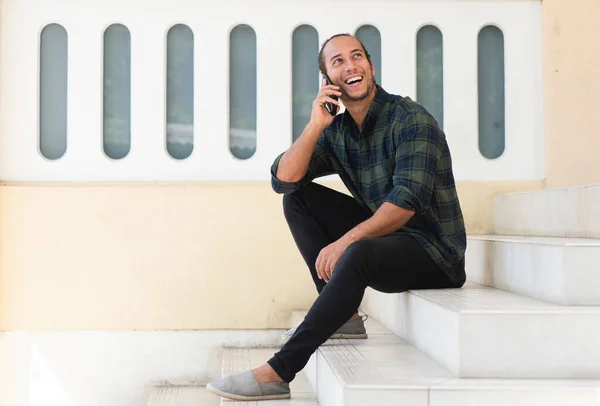 Happy Man Talking Mobile Phone While Sitting Outdoors Staircase — ストック写真