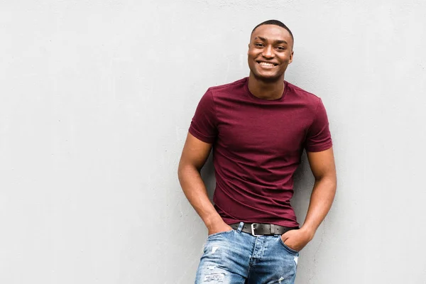 Portrait Handsome Young African American Man Leaning Gray Wall Smiling — Stock Photo, Image