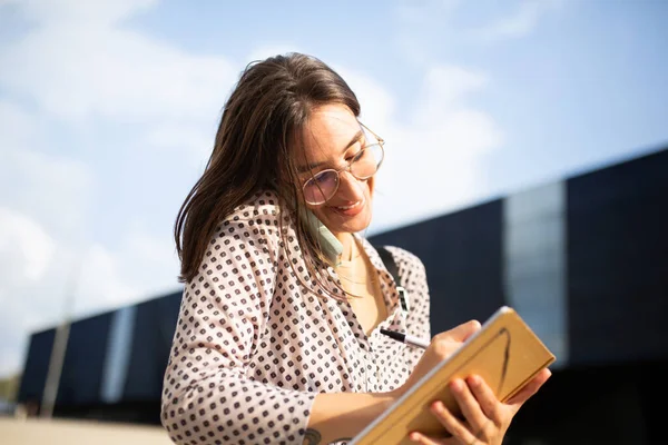 Portrait Young Businesswoman Student Standing Talking Mobile Phone Writing Book — Stock Photo, Image