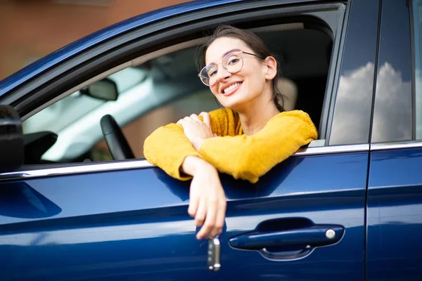 Portrait Smiling Young Woman Sitting Her New Car Keys Hand — Stock Photo, Image