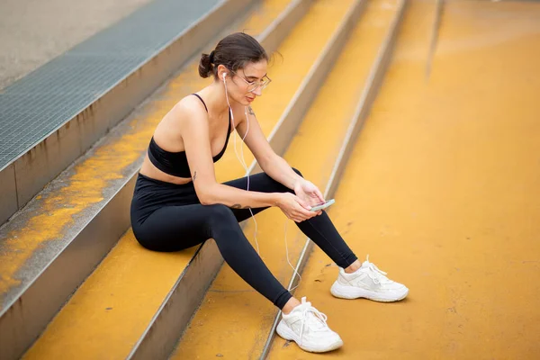 Portrait Healthy Young Woman Sitting Steps Mobile Phone Earphones Listening — Stock Photo, Image