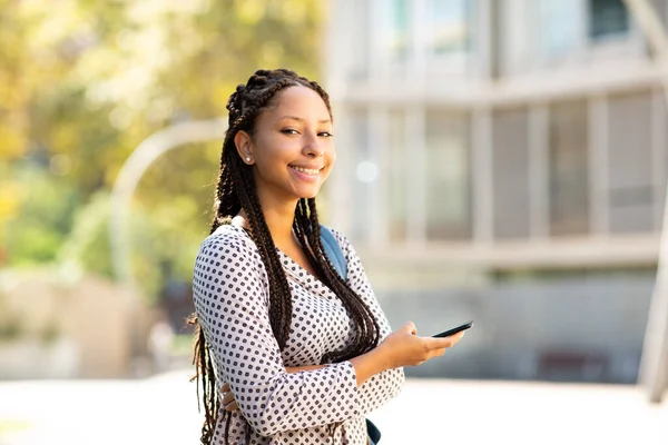 Portrait Beautiful Young African Woman Standing Cellphone Smiling Camera — Stock Photo, Image