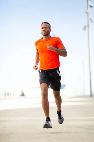 Young Fit Male Athlete Jogging Outdoors City Royalty Free Stock Photos
