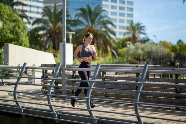 Full Length Side Portrait Fitness Woman Running Bridge — Stock Photo, Image