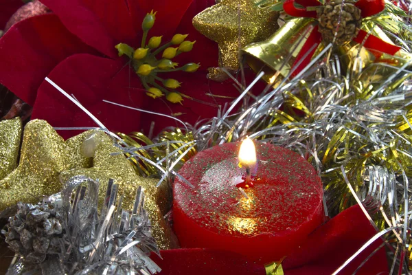 Christmas candle with poinsettia — Stock Photo, Image
