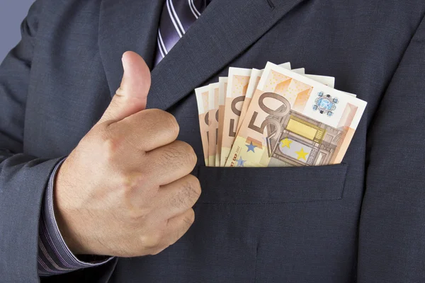 Man with money in his pocket — Stock Photo, Image