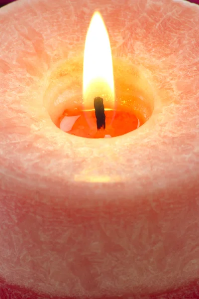 Close up to the flame of a red candle Royalty Free Stock Images