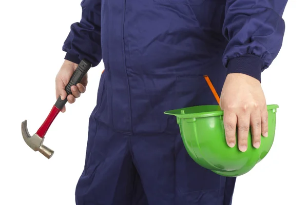 Trabajador sosteniendo un casco y un martillo —  Fotos de Stock