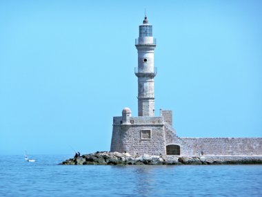 Lighthouse, men fishing and sail boat, Chania, Crete, Greece clipart